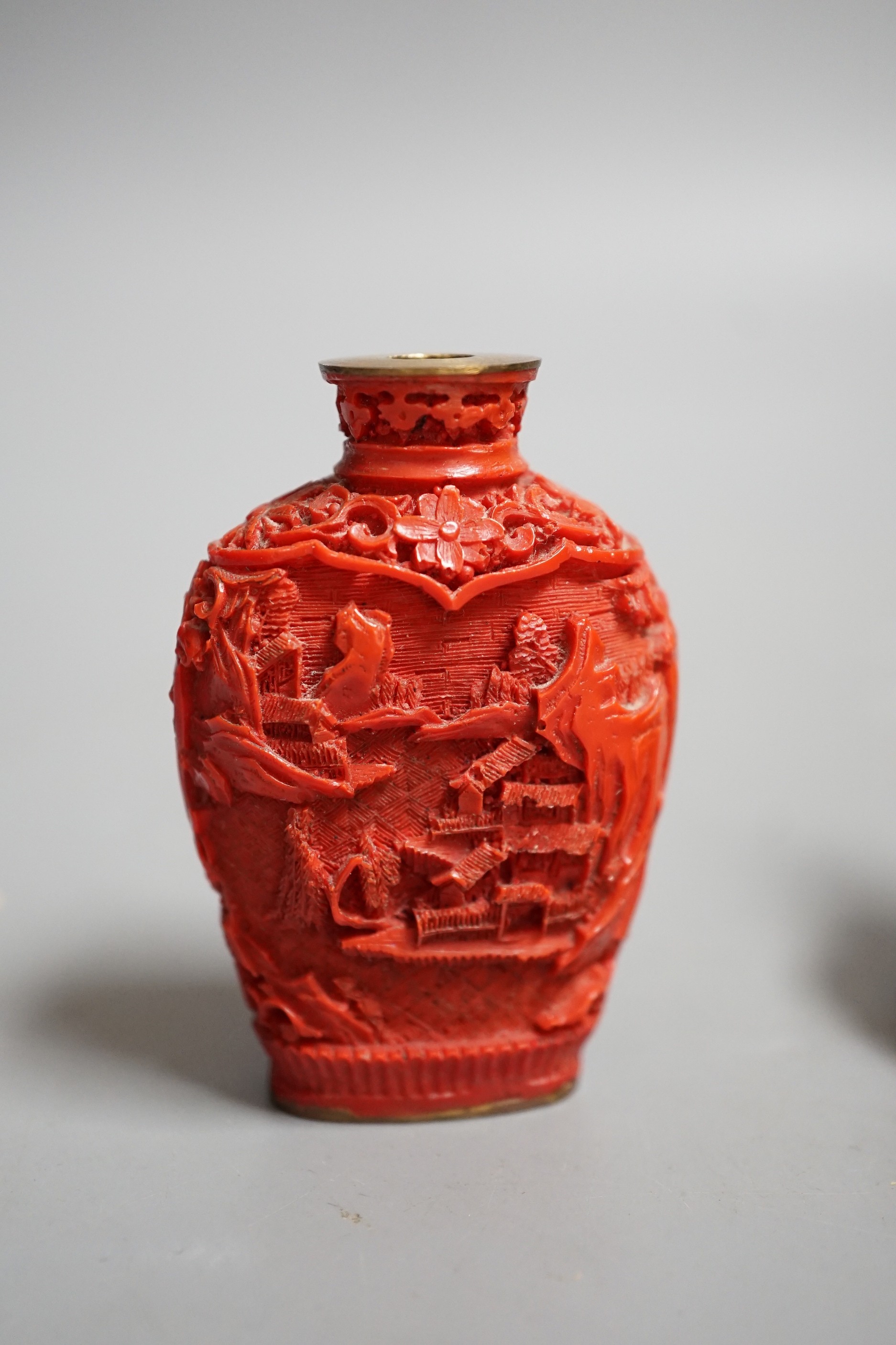 A Chinese resin snuff bottle, a resin Buddha on stand and a resin netsuke